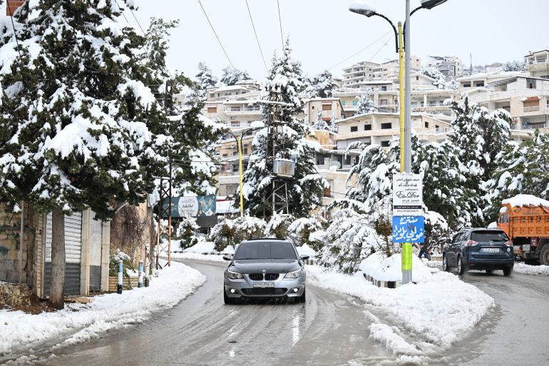 TOPSHOT - This photo taken on January 14, 2026 shows the snow covered Syrian town of Bludan, some 50 kilometres northwest of the capital Damascus. (Photo by LOUAI BESHARA / AFP)