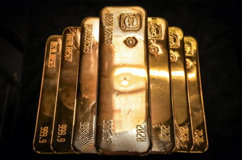 (FILES) Gold bullion bars are pictured after being inspected and polished at the ABC Refinery in Sydney on August 5, 2020.