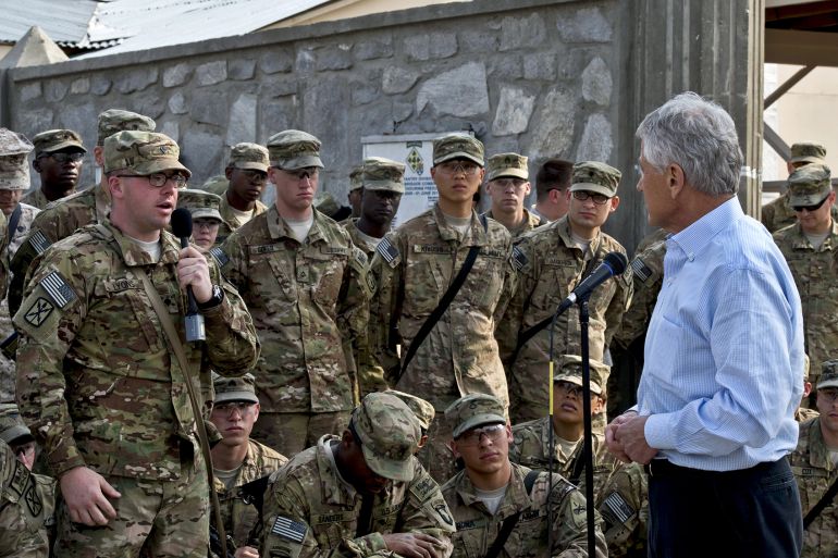 Chuck Hagel the US Defence Secretary, listens to a question from a U.S. soldier in Jalalabad, Afghanistan 2013. (Photo by: Universal History Archive/Universal Images Group via Getty Images)
