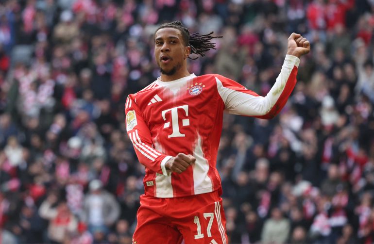 Bayern Munich's French midfielder #17 Michael Olise celebrates his 1-0 during the German first division Bundesliga football match between FC Bayern Munich and Union Berlin in Munich, southern Germany, on March 21, 2026. (Photo by Karl-Josef HILDENBRAND / AFP) / DFL REGULATIONS PROHIBIT ANY USE OF PHOTOGRAPHS AS IMAGE SEQUENCES AND/OR QUASI-VIDEO