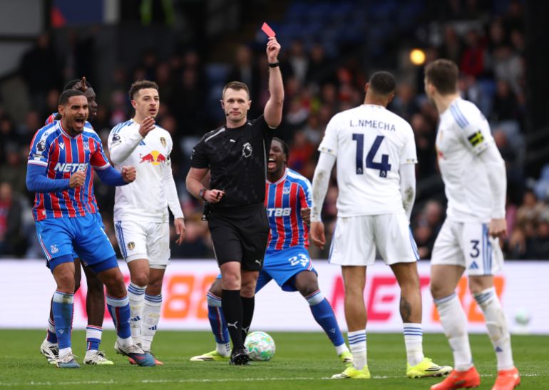 LONDON, ENGLAND - MARCH 15: Referee Thomas Bramall shows a red card to Gabriel Gudmundsson of Leeds United during the Premier League match between Crystal Palace and Leeds United at Selhurst Park on March 15, 2026 in London, England. (Photo by Alex Pantling/Getty Images)
